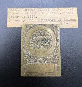 A small Brass Plaque donated to the Museum in June 1935 by Bro Guy Frossard.