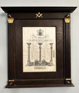 Grand Lodge Certificate framed in an oak frame and decorated with columns and Masonic symbols.