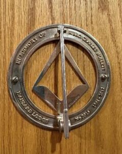 Silver door knocker from the door of the Main Temple at the Masonic Centre.